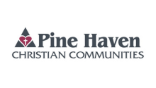 Cross inside a heart inside a triangle Pine Haven Christian Communities logo