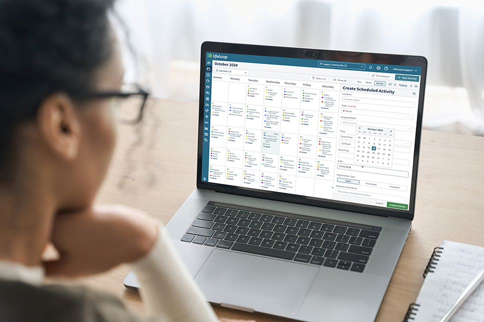 Woman looking at LifeLoop Calendars on her laptop