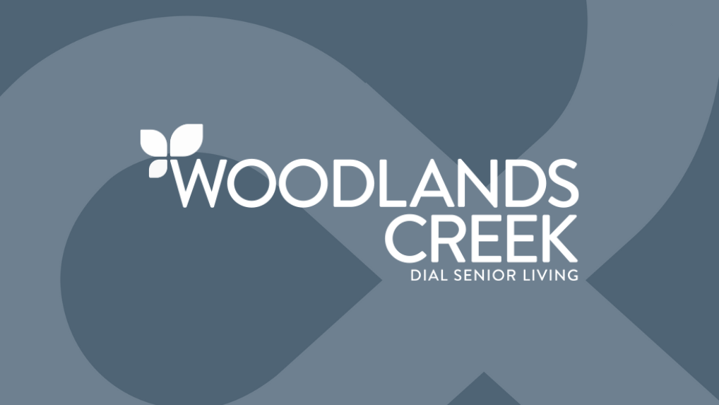 Woodlands Creek logo on gray background