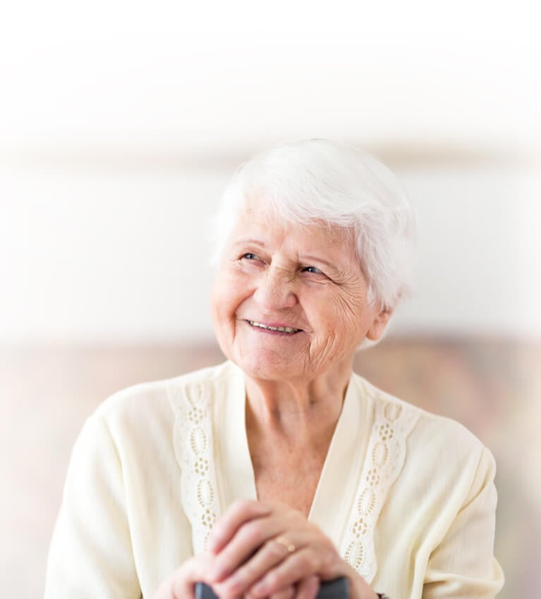 Memory Care - an elderly woman smiles